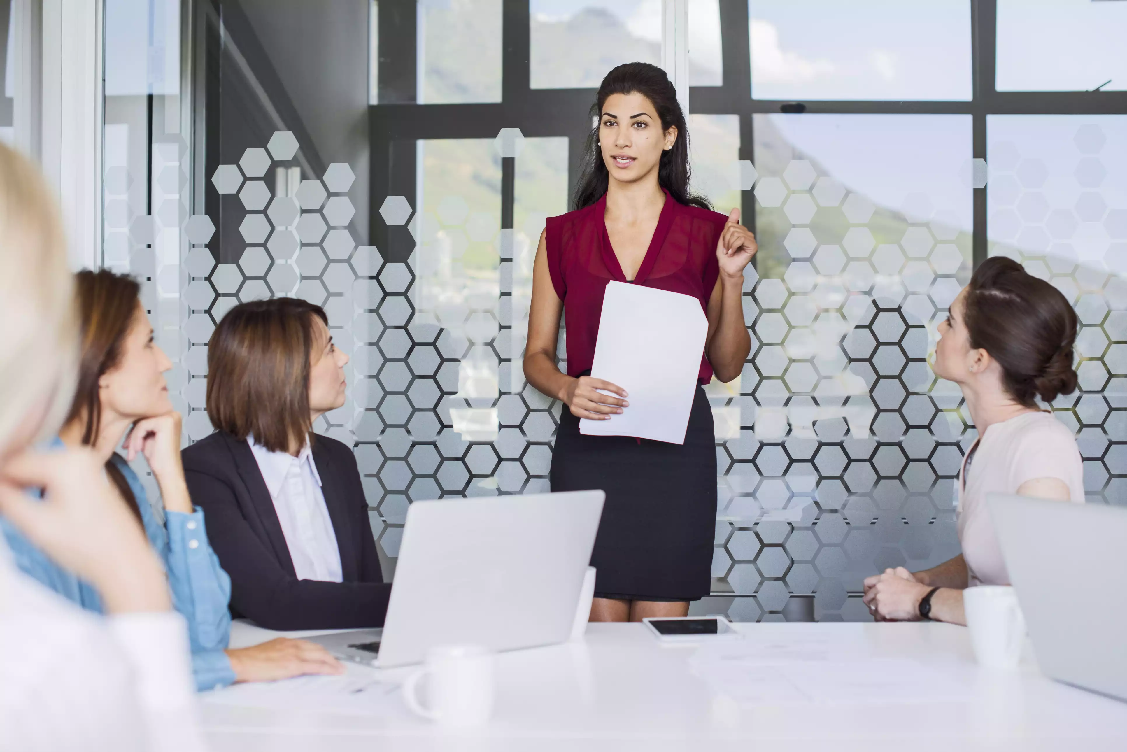 woman talking in front of a group
