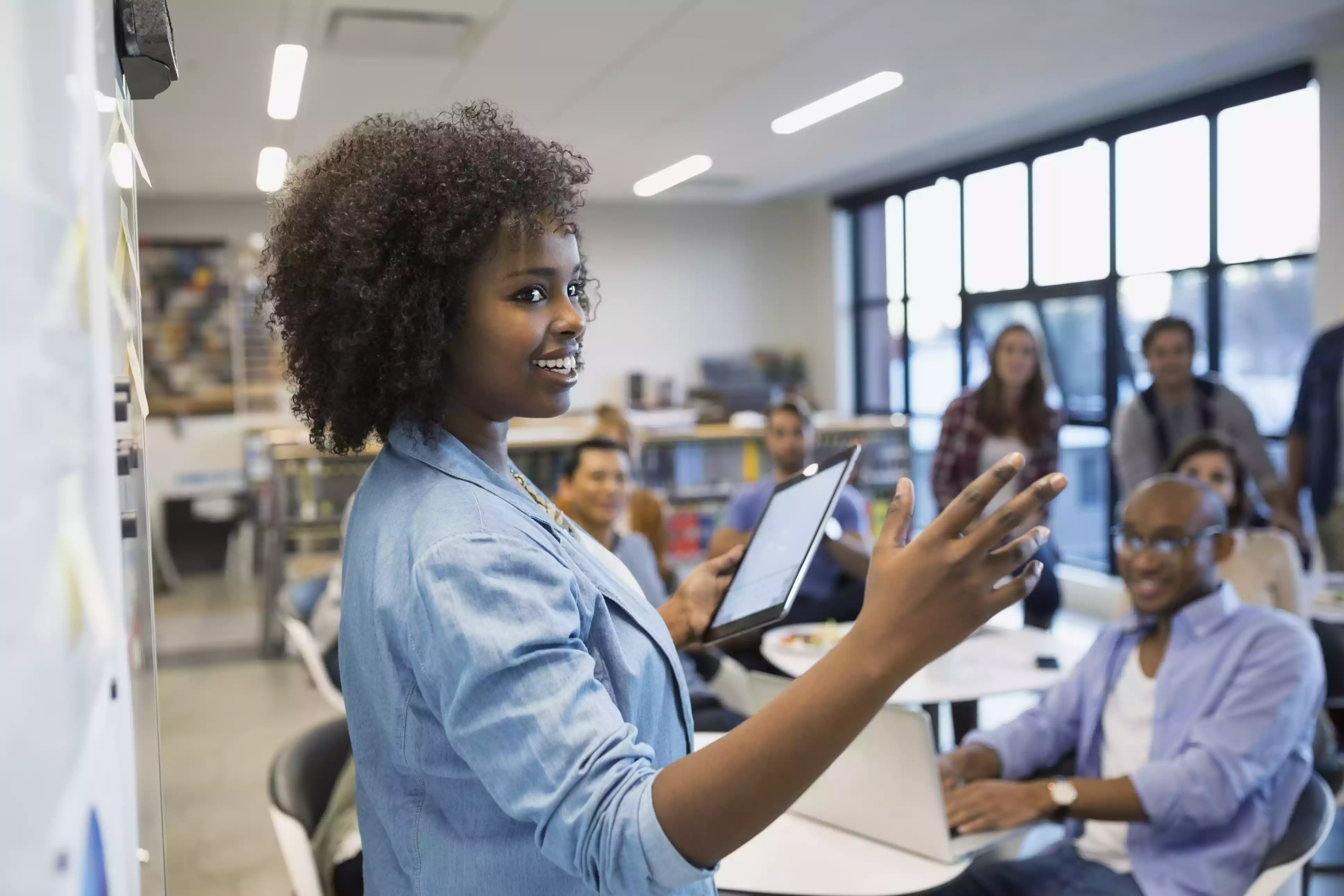smiling woman giving presentation